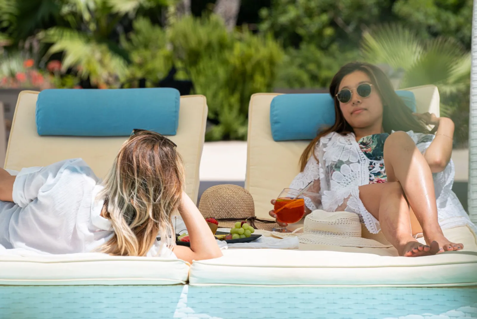 By the pool - Aurora Luxury Suites