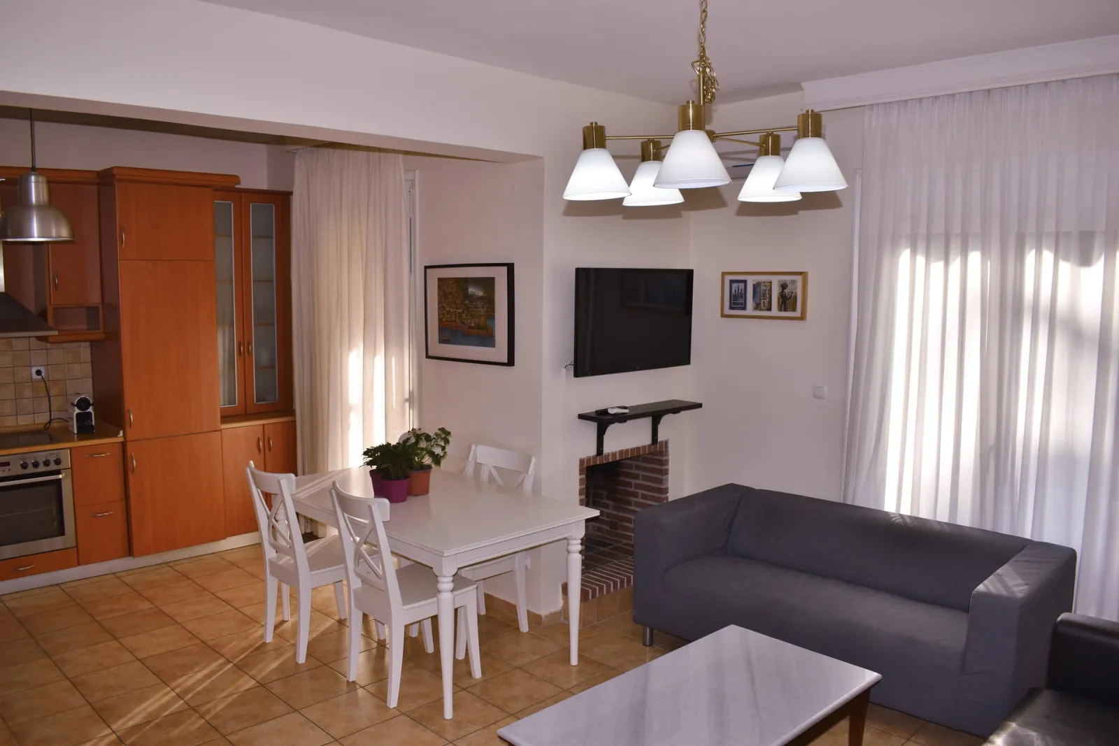 Kripis house villa PefkohoriFirst level- Sitting room with kitchen and private small garden. Also small WC in this level- A/C