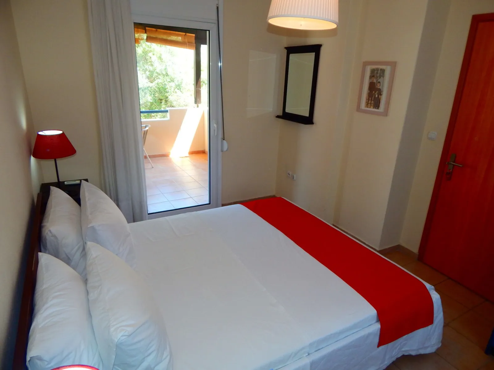 Kripis house villa Pefkohori.Second level-Double room in first floor -big balcony with  view to the garden.A/C.