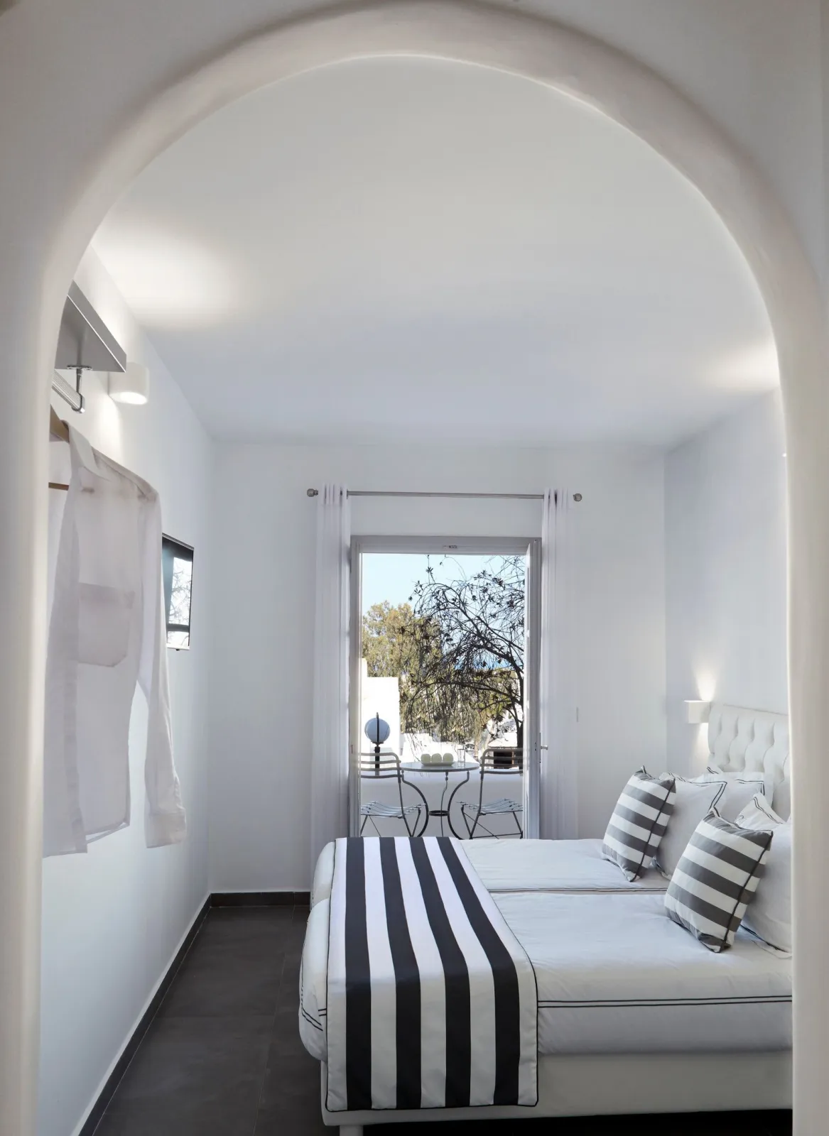 Elegant White Deluxe Room with Private Balcony