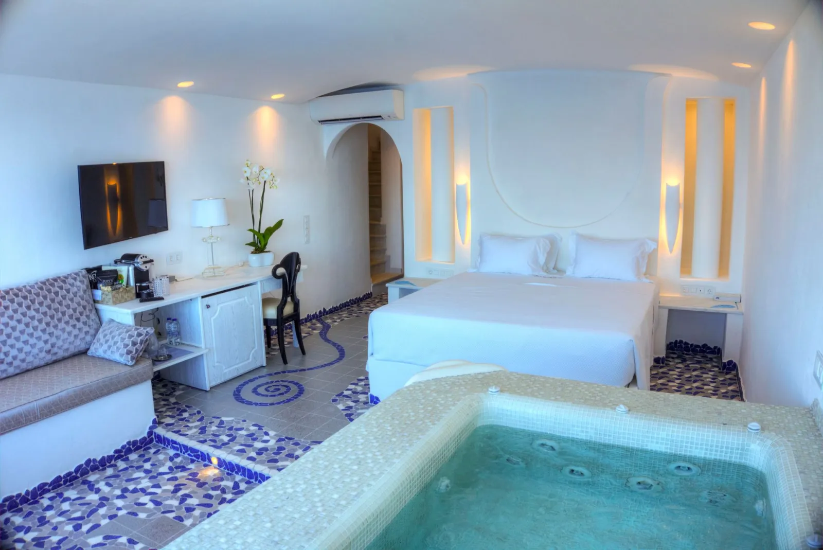Cave Pool Suite with private cave pool indoor couples Jacuzzi and private panoramic terrace with sea/volcano/caldera views