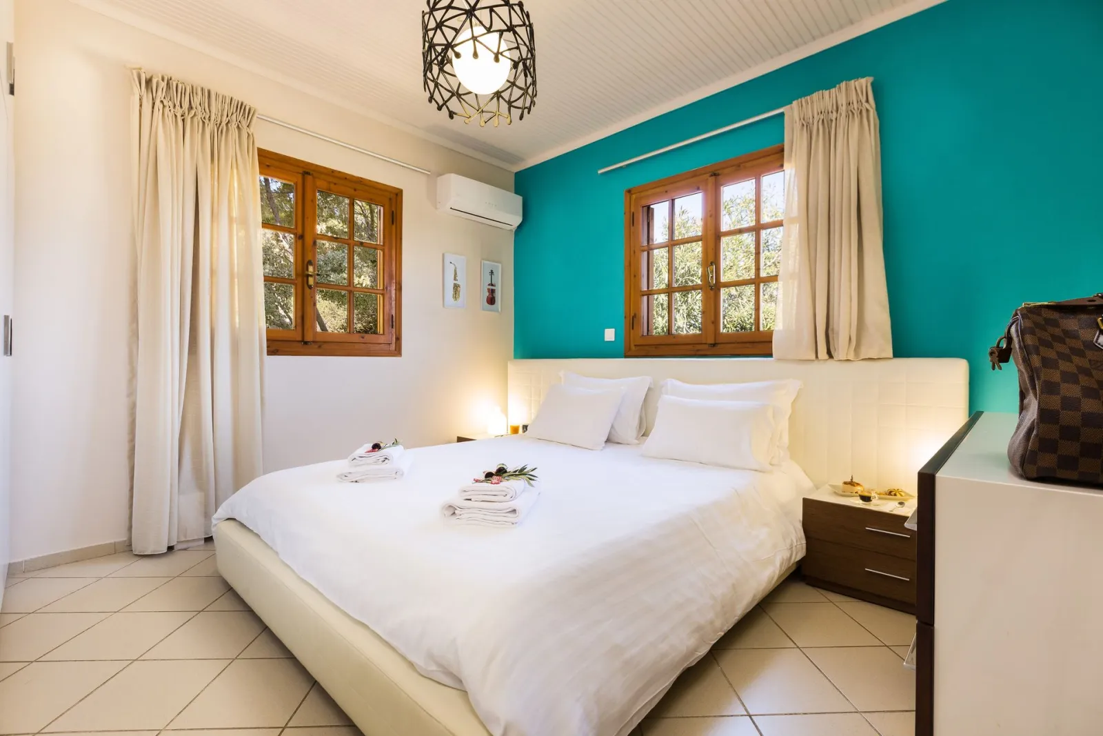 Bedroom with large double bed (2 bedroom villa)