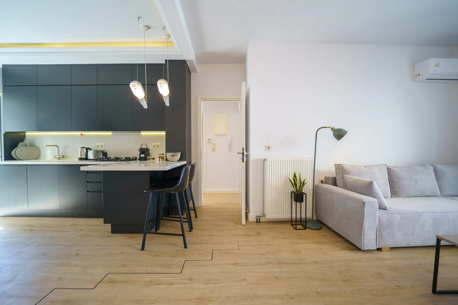 Kitchen area connected to Living room area